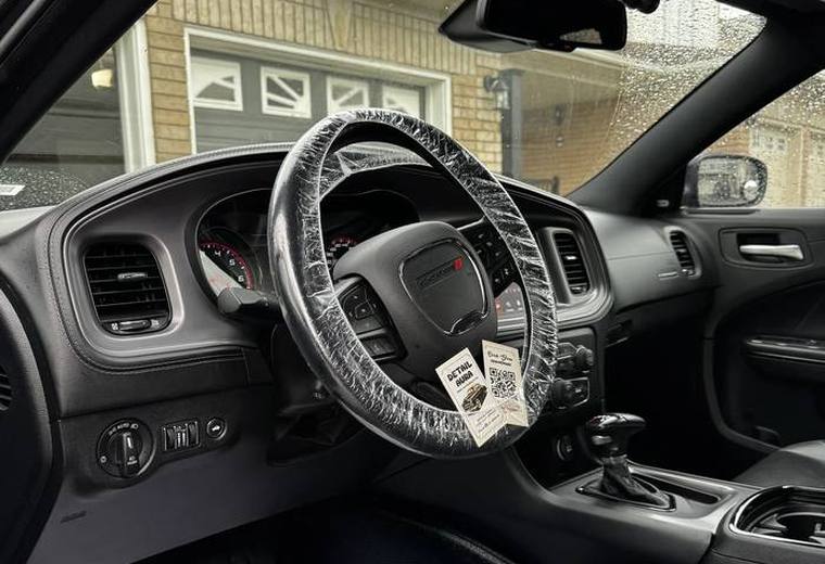 Dodge Charger cabin with plastic wheel cover and paper mat